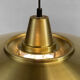 Large brushed aluminum pendant light with golden finish. Produced by Jeka. Denmark 1970s