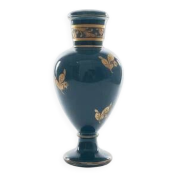 Small turquoise blue and gold porcelain vase with elegant floral patterns.