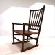 Fauteuil Manou en rotin et assise en cuir, 1960