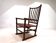 Fauteuil Manou en rotin et assise en cuir, 1960