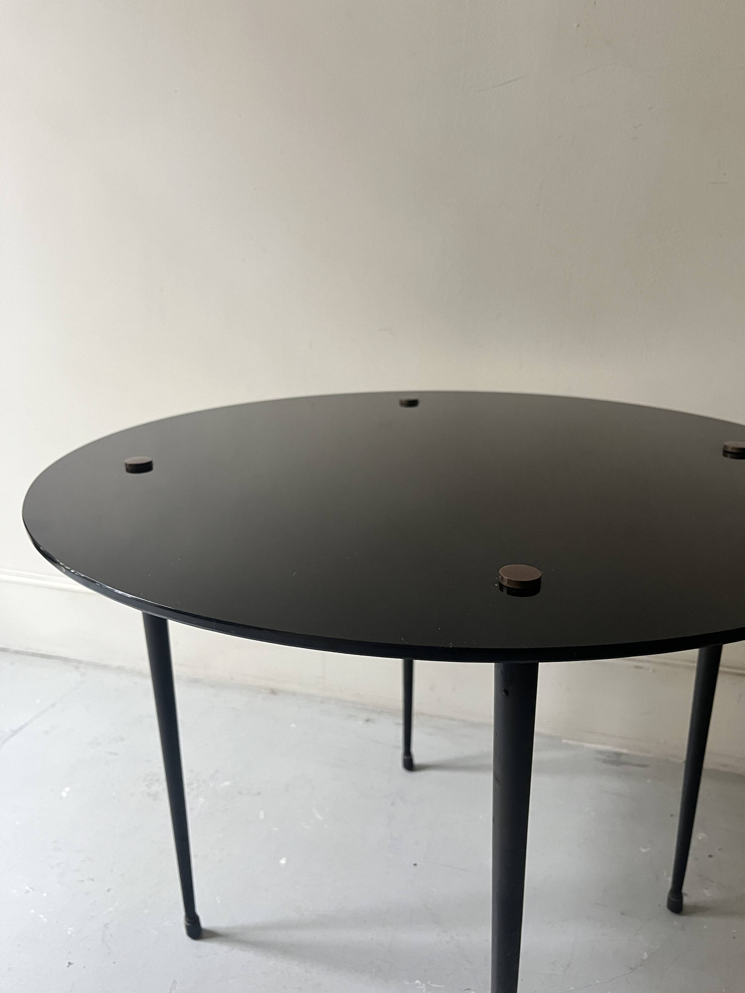 Vintage round black glass coffee table, 1950s