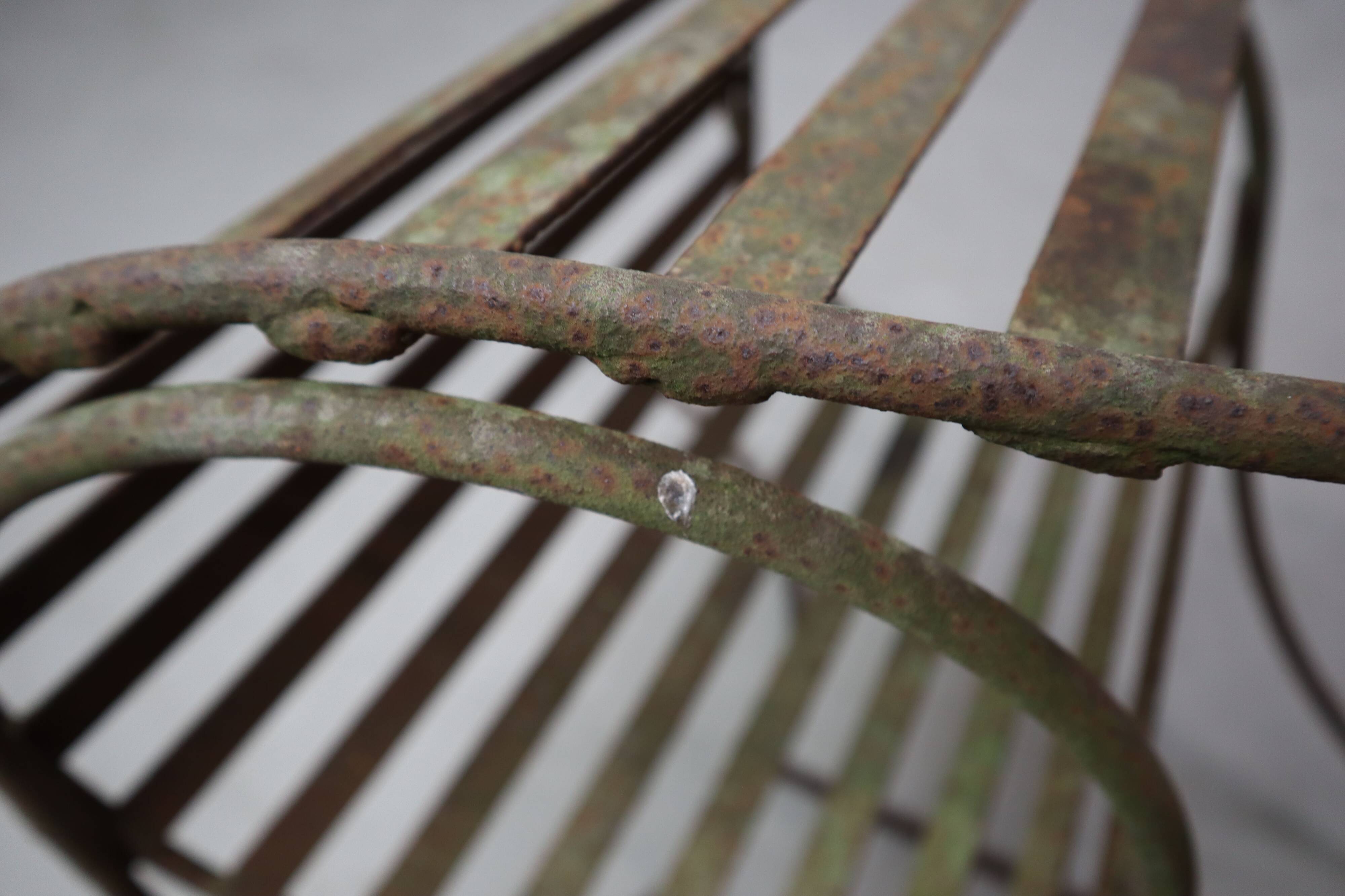 Set of three sculptural iron chairs