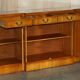 Vintage buffet made of mottled yew wood with three doors and four drawers.