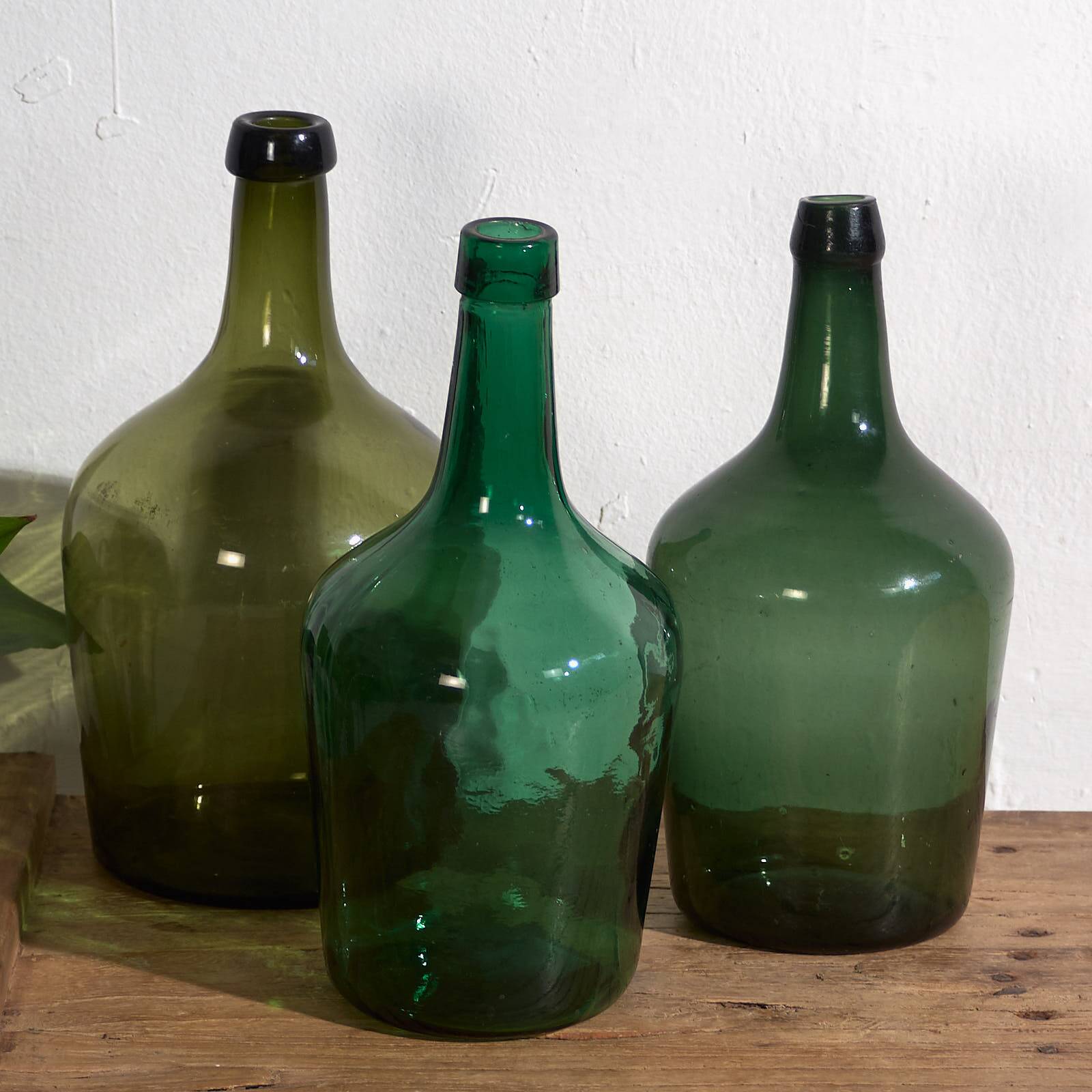 Antique green demijohns (c.1920). Set of 3 pieces