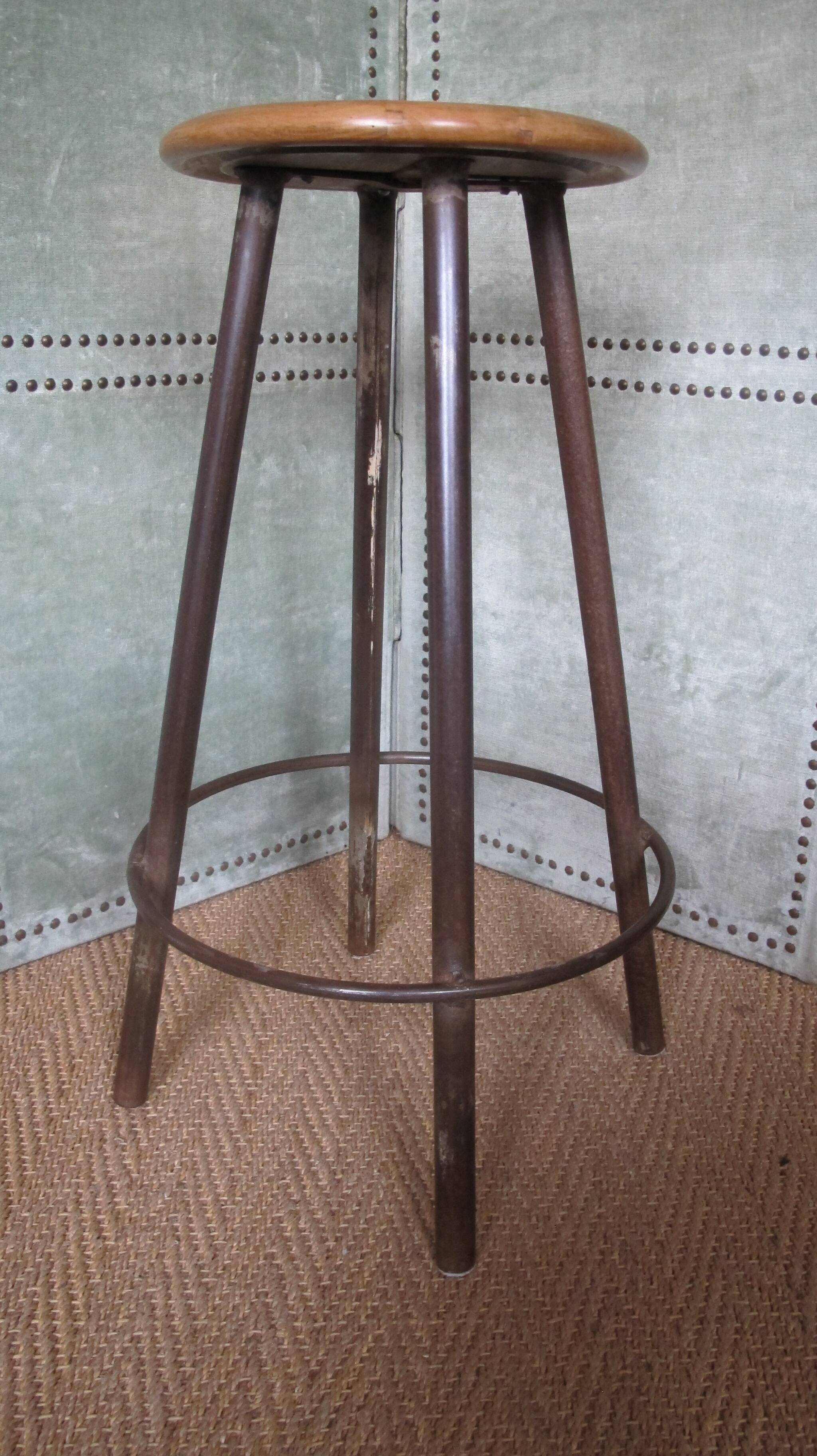 high factory stool made of wood and metal