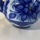 Glazed ceramic carafe with floral decoration