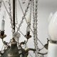 Louis XVI style chandelier with a pearl garland and painted tin, 20th century.