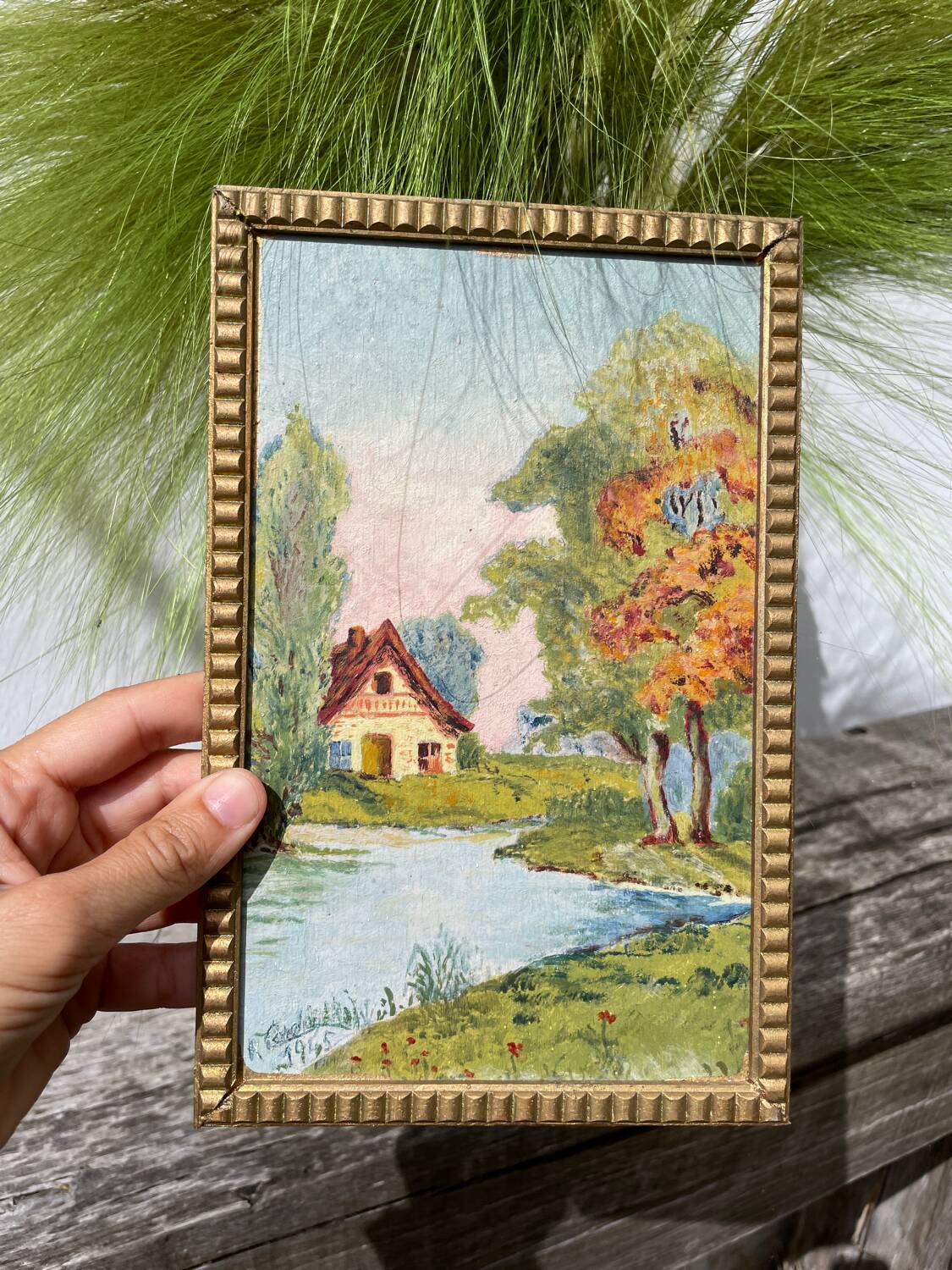 Small landscape painting with golden frame