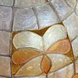 Mother-of-pearl and brass pendant with floral decoration.