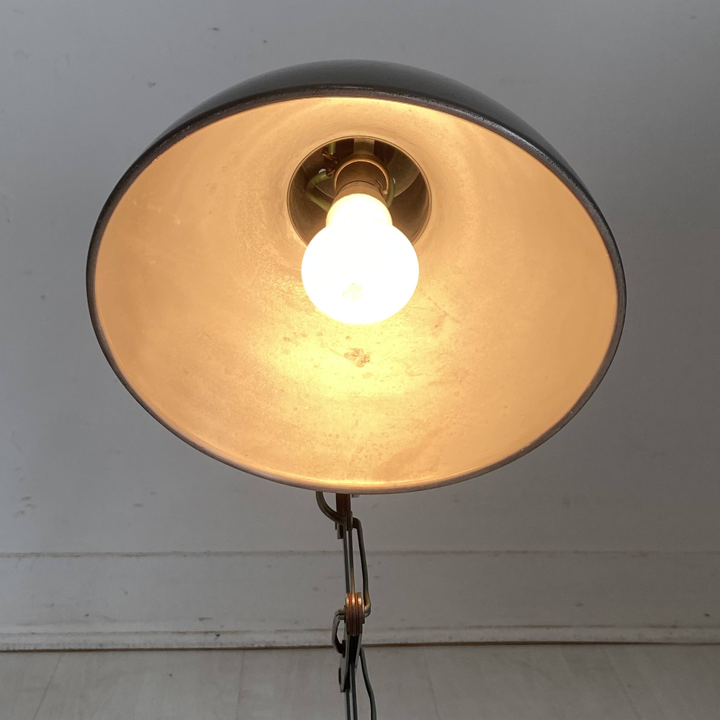 Vintage 1950s green lacquered sheet metal workshop wall light with accordion arm.