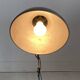 Vintage 1950s green lacquered sheet metal workshop wall light with accordion arm.