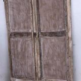 Chiseled teak door with openwork wrought iron panels