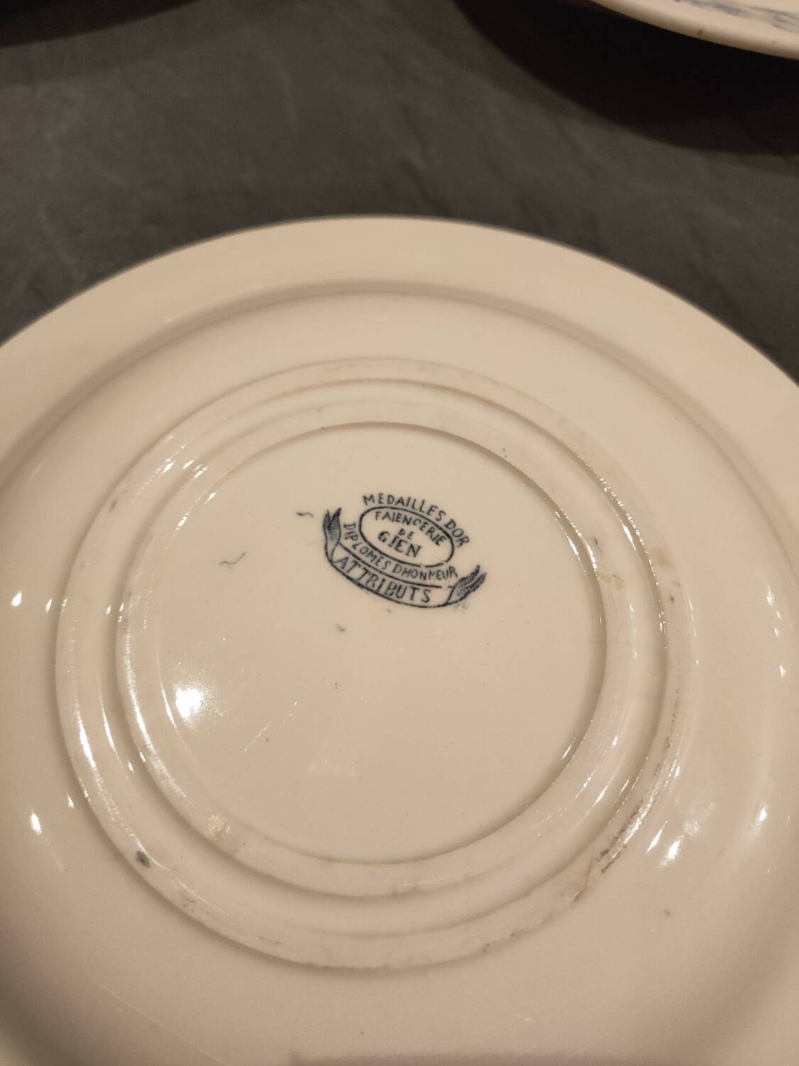 Service of old Gien earthenware plates and dishes