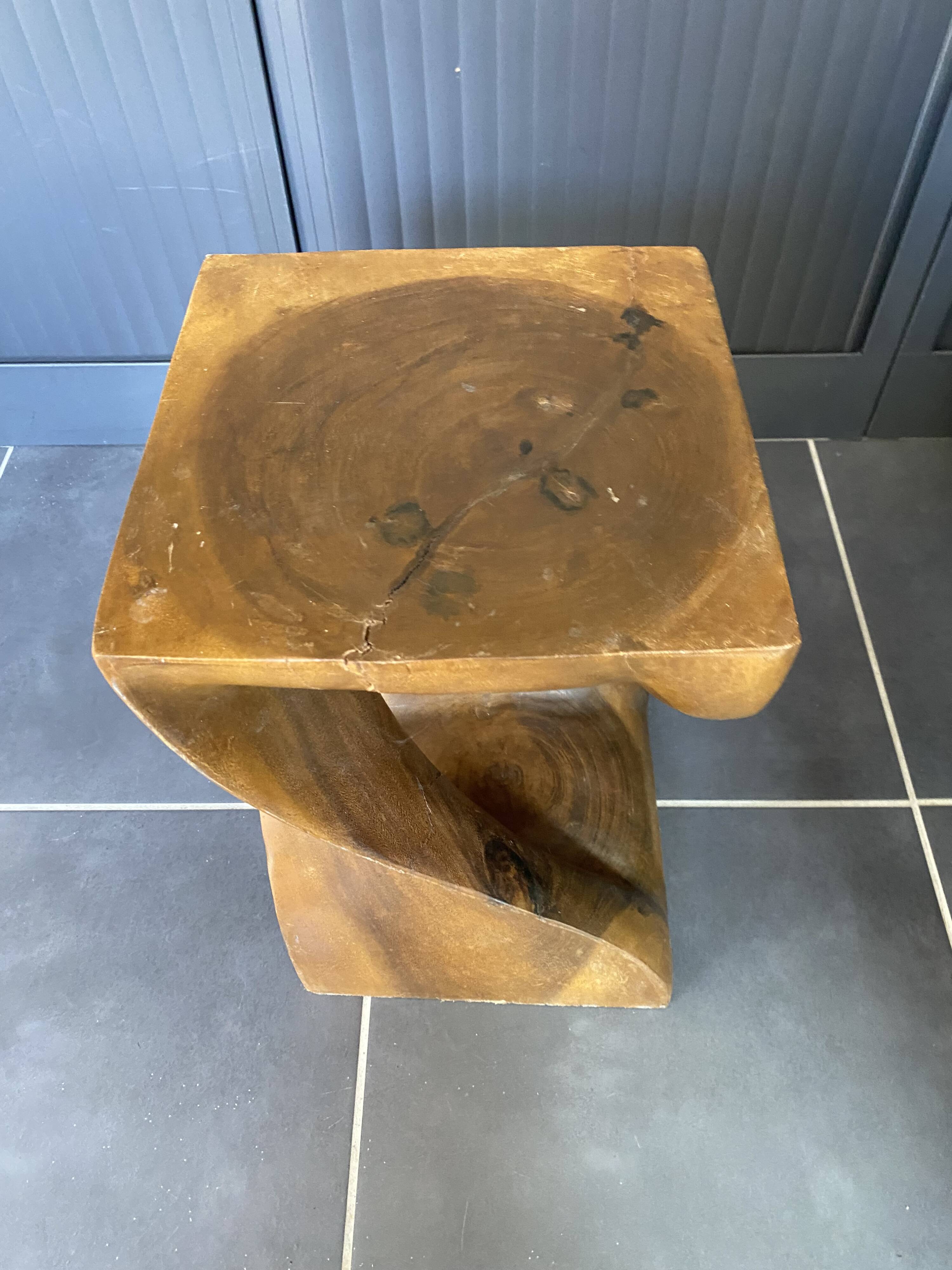 Stool n2 in solid raw walnut wood carved from the mass 1970