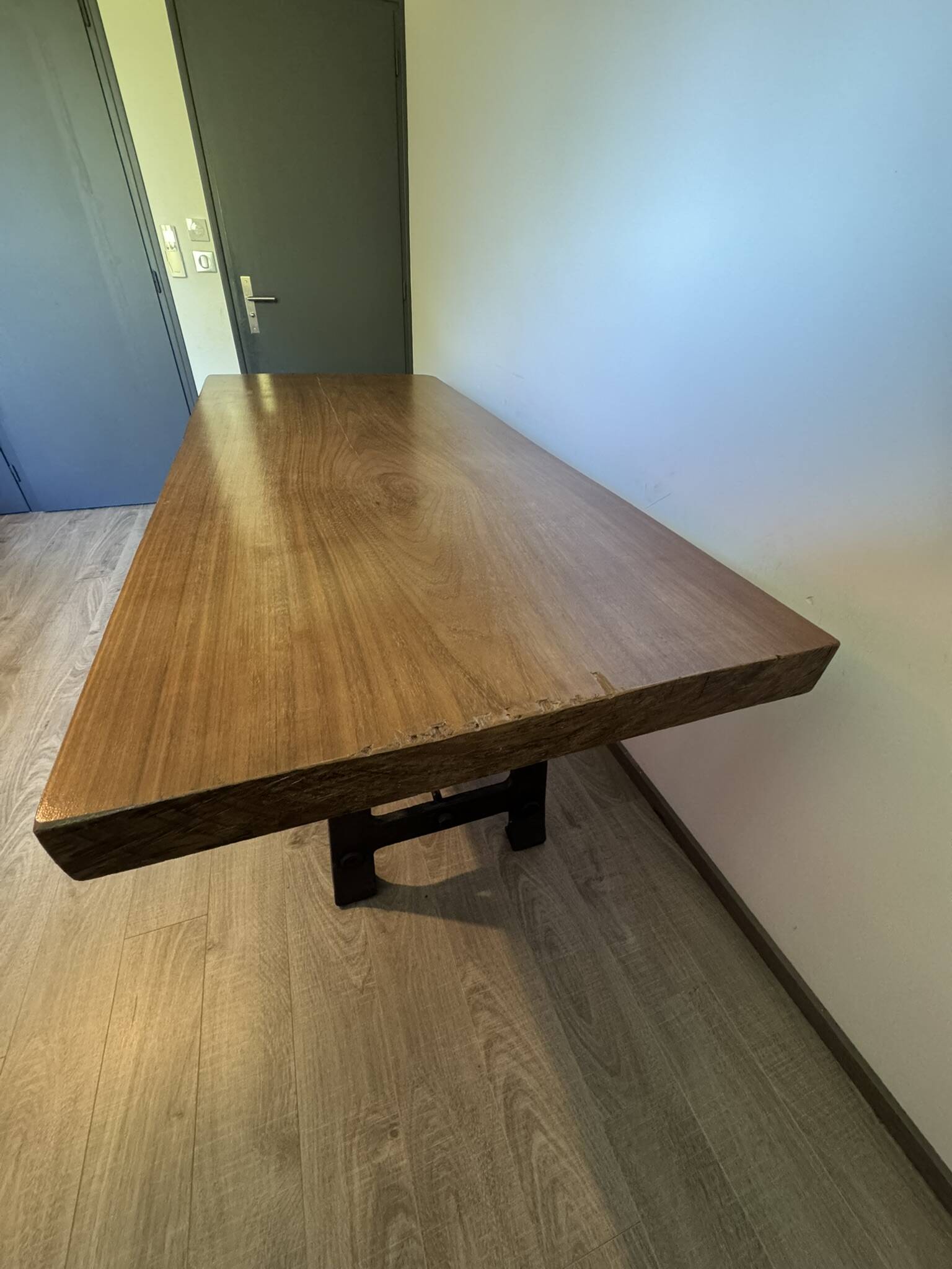 Industrial style table with a mahogany top.