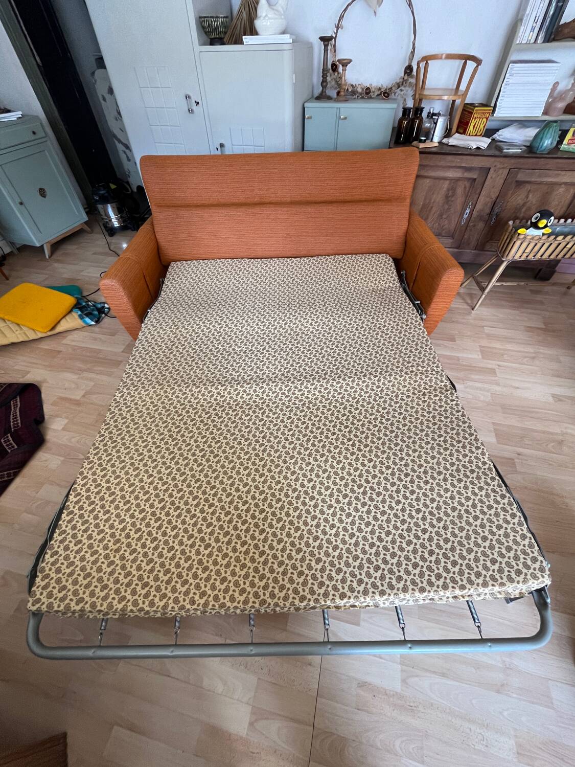 Vintage orange convertible sofa