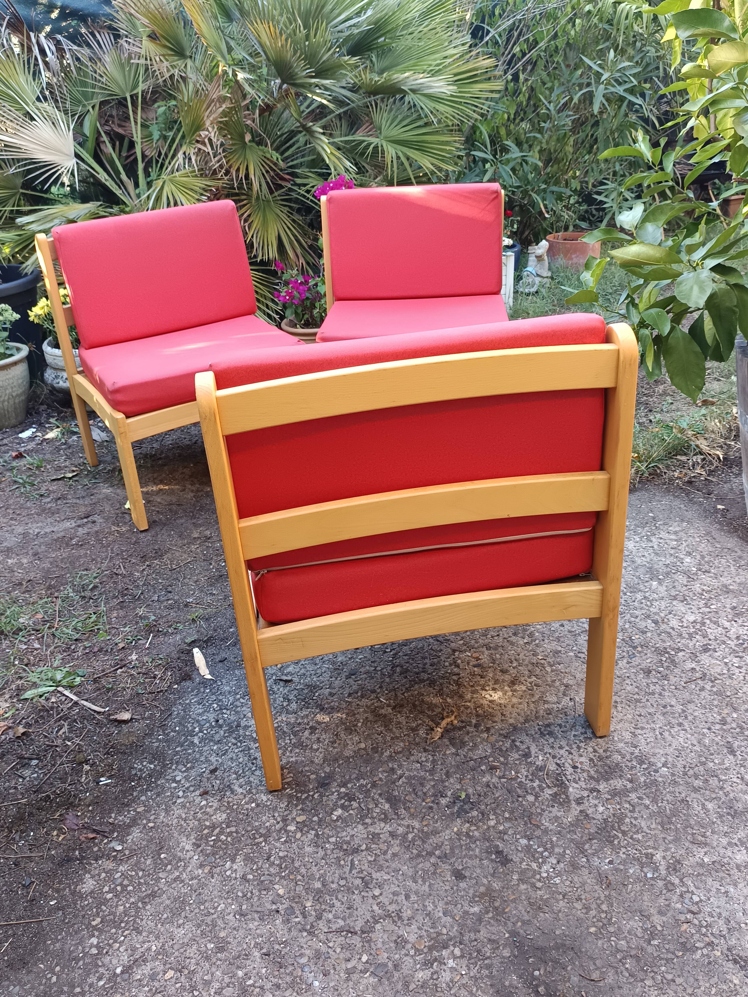 Set of 3 vintage armchairs from the 60s/70s – light wood and red faux leather.