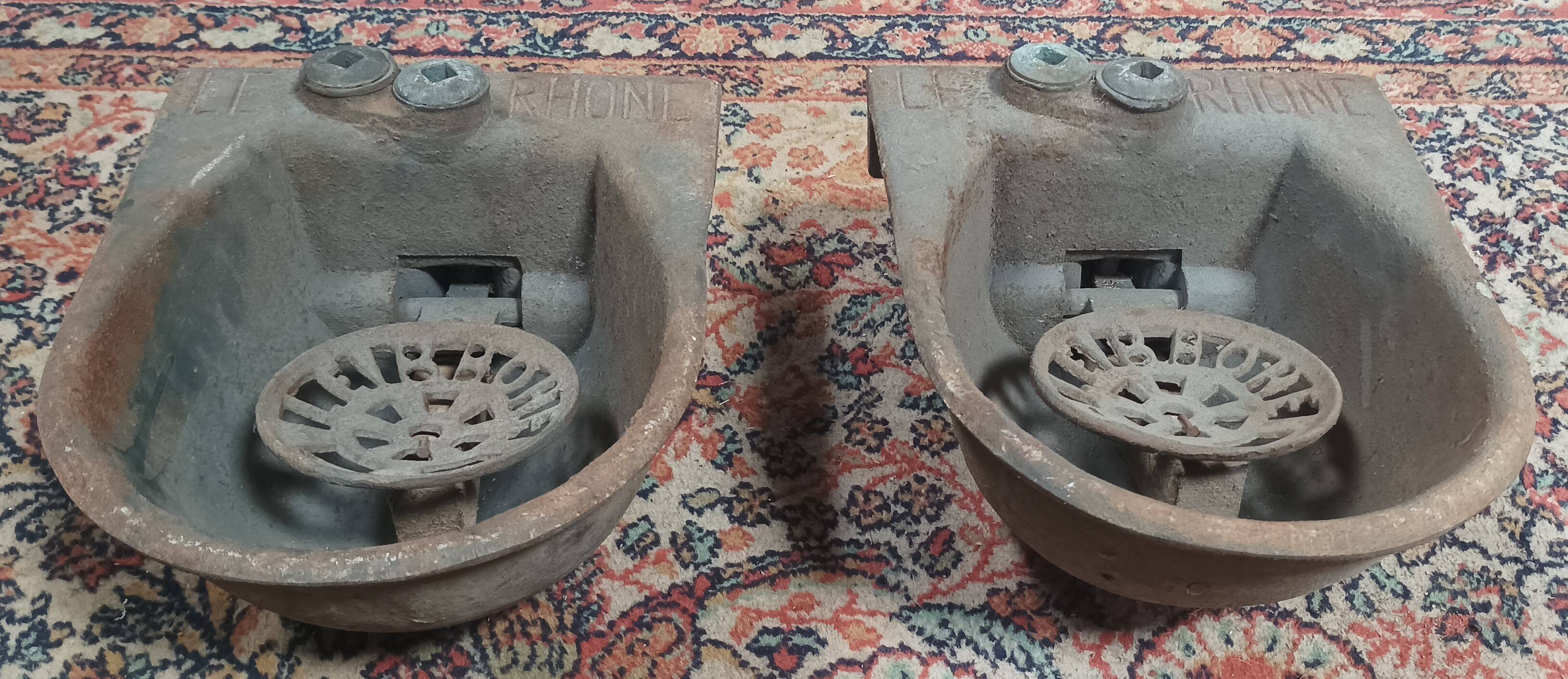 Pair of old cast iron Le Rhône drinking troughs
