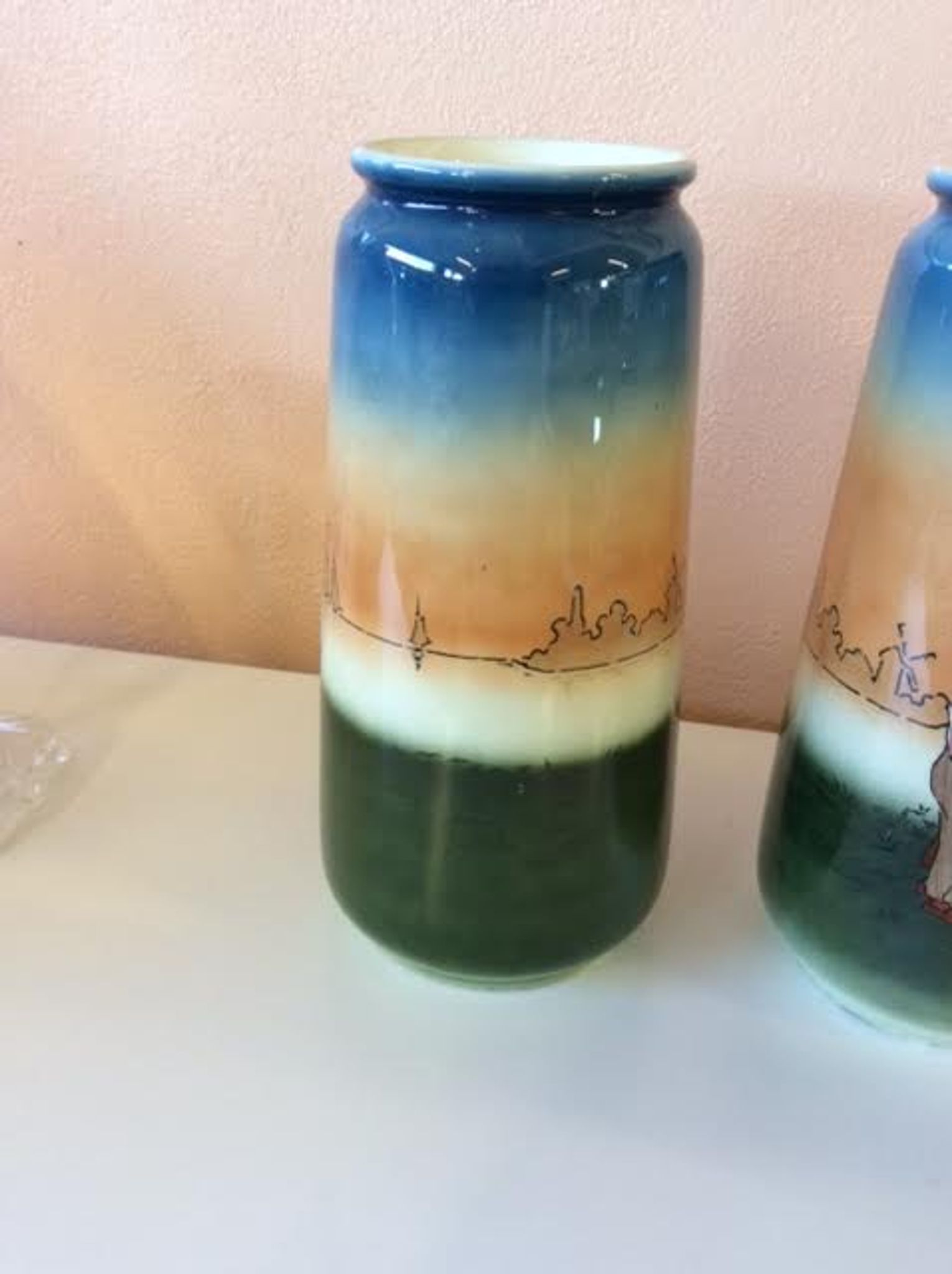 Pair of enamelled sandstone vases