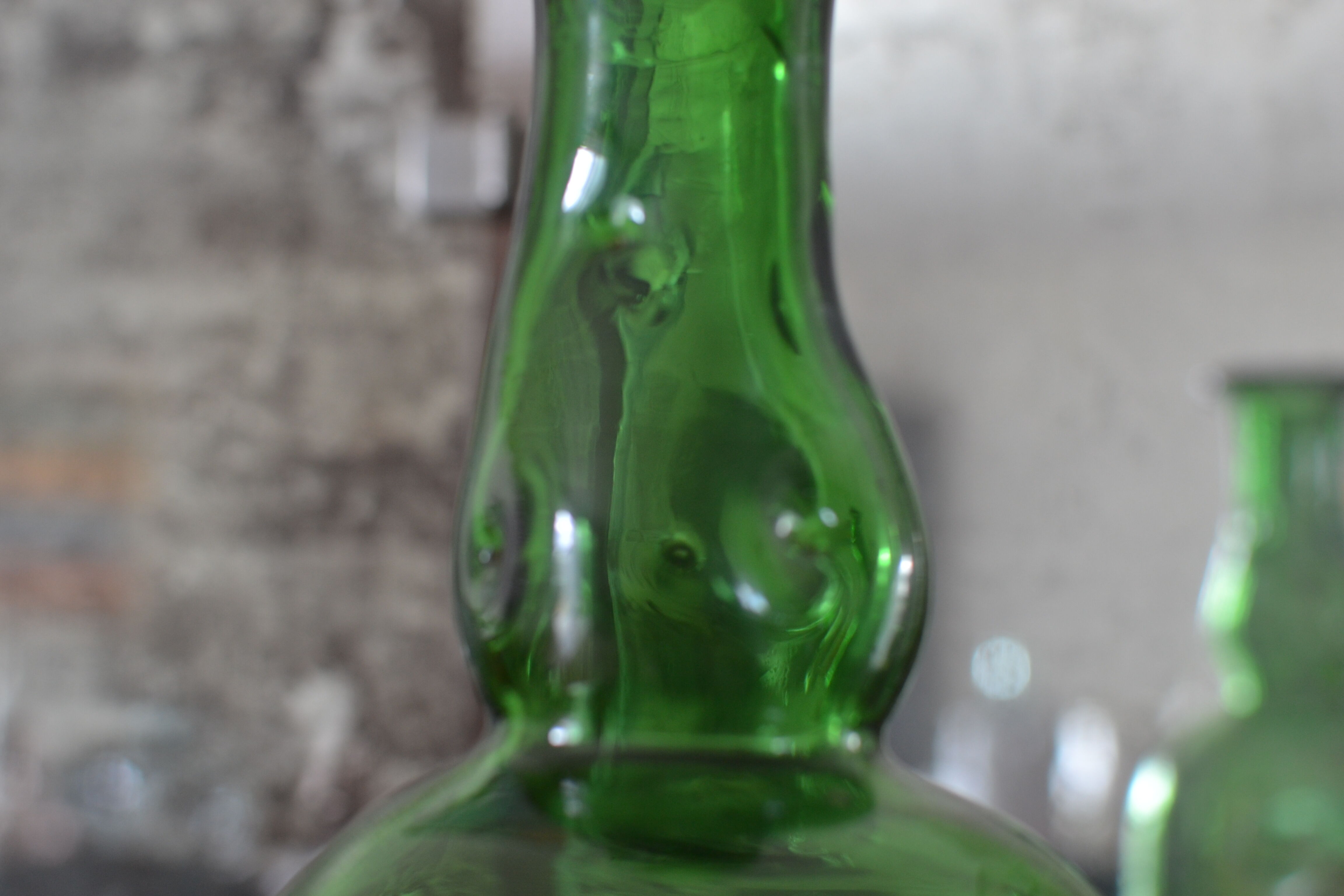 Dented green bottle
