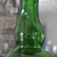 Dented green bottle