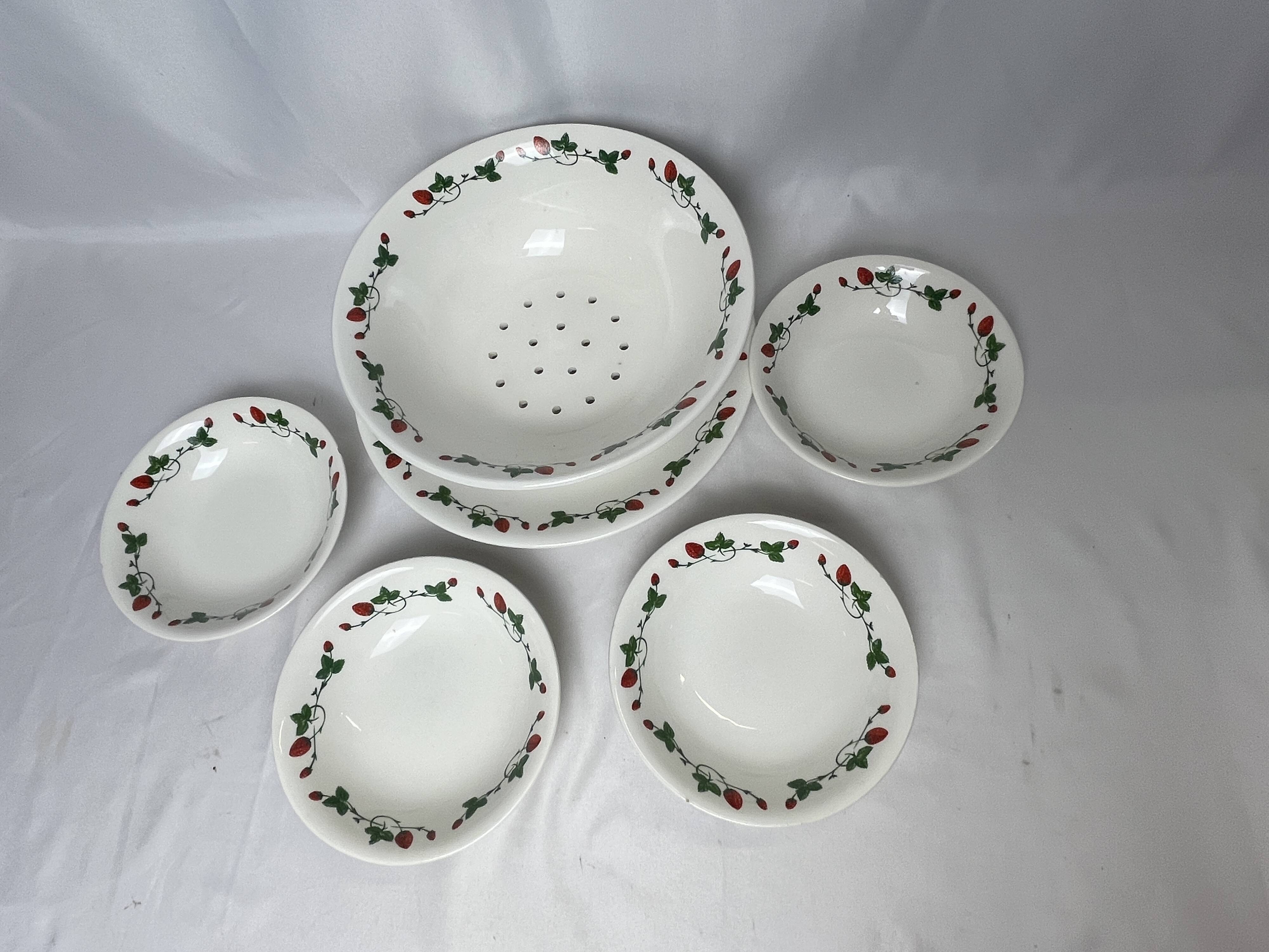 GIEN, strawberry draining bowl and earthenware dishes, 20th century