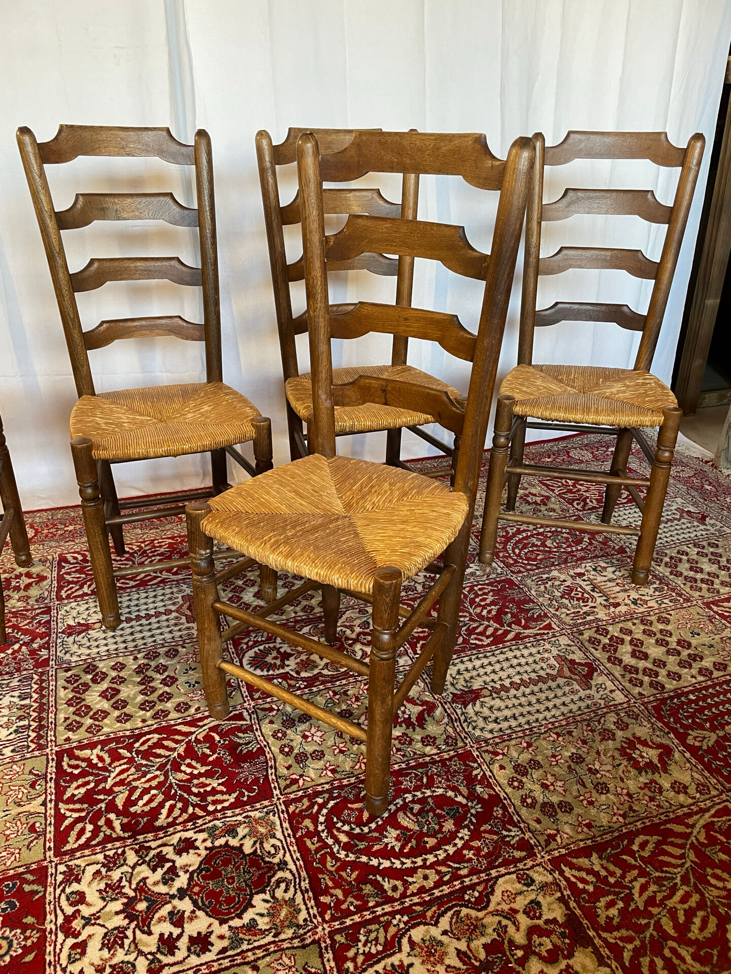 Set of 5 antique oak and straw chairs.