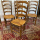 Set of 5 antique oak and straw chairs.