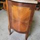Curved chest of drawers in rosewood and marble marquetry