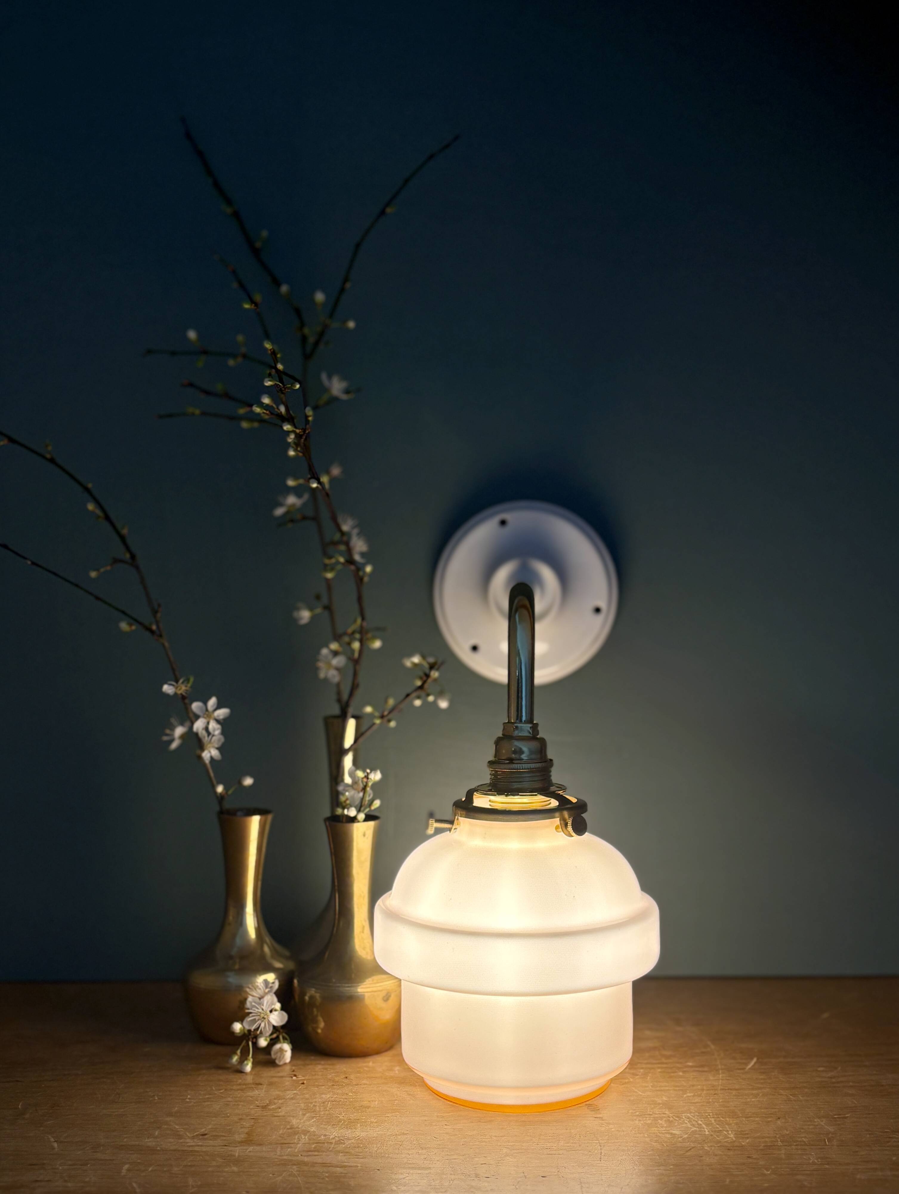 Vintage pink opaline globe wall light.