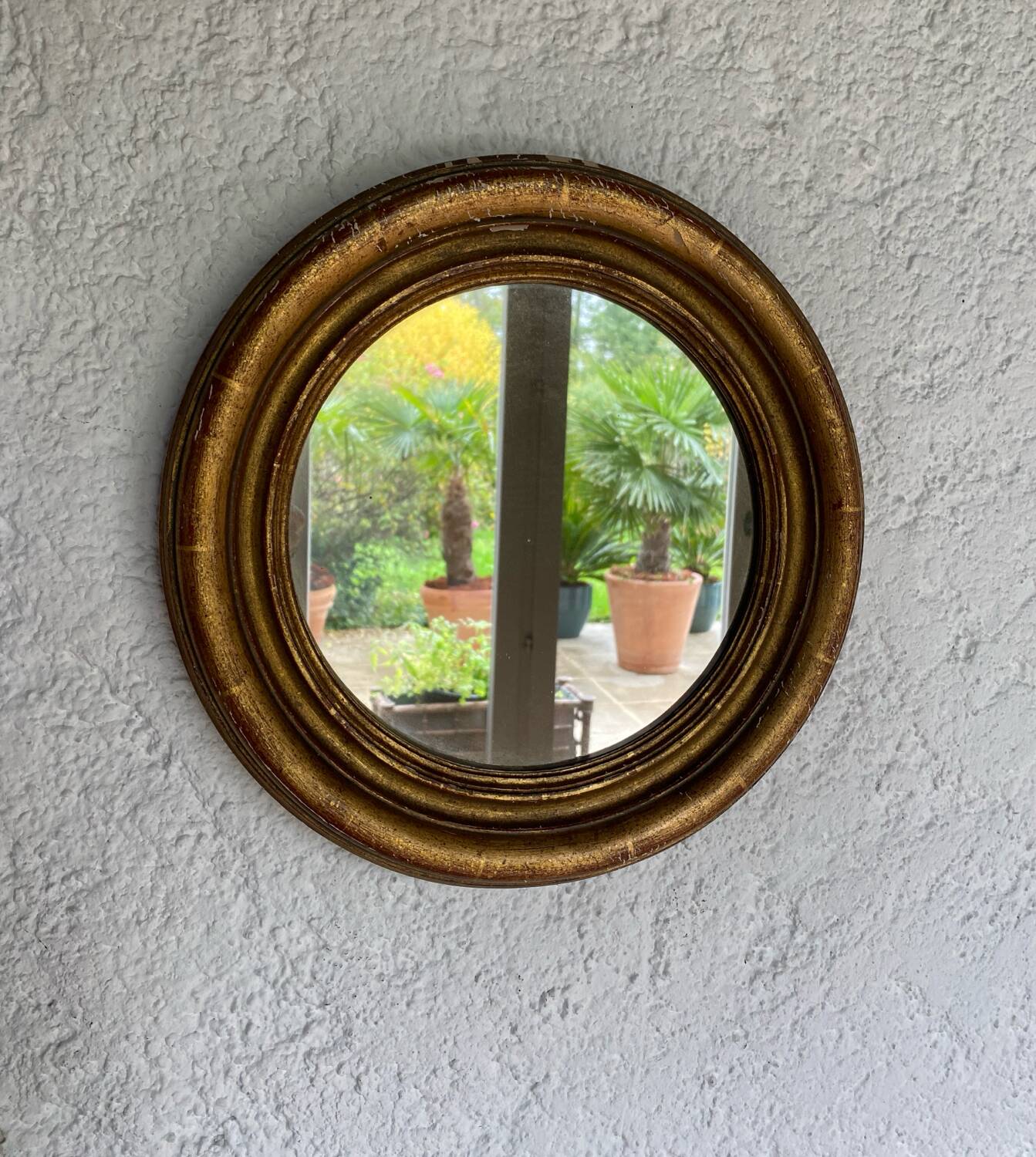Miroir rond en bois doré ancien