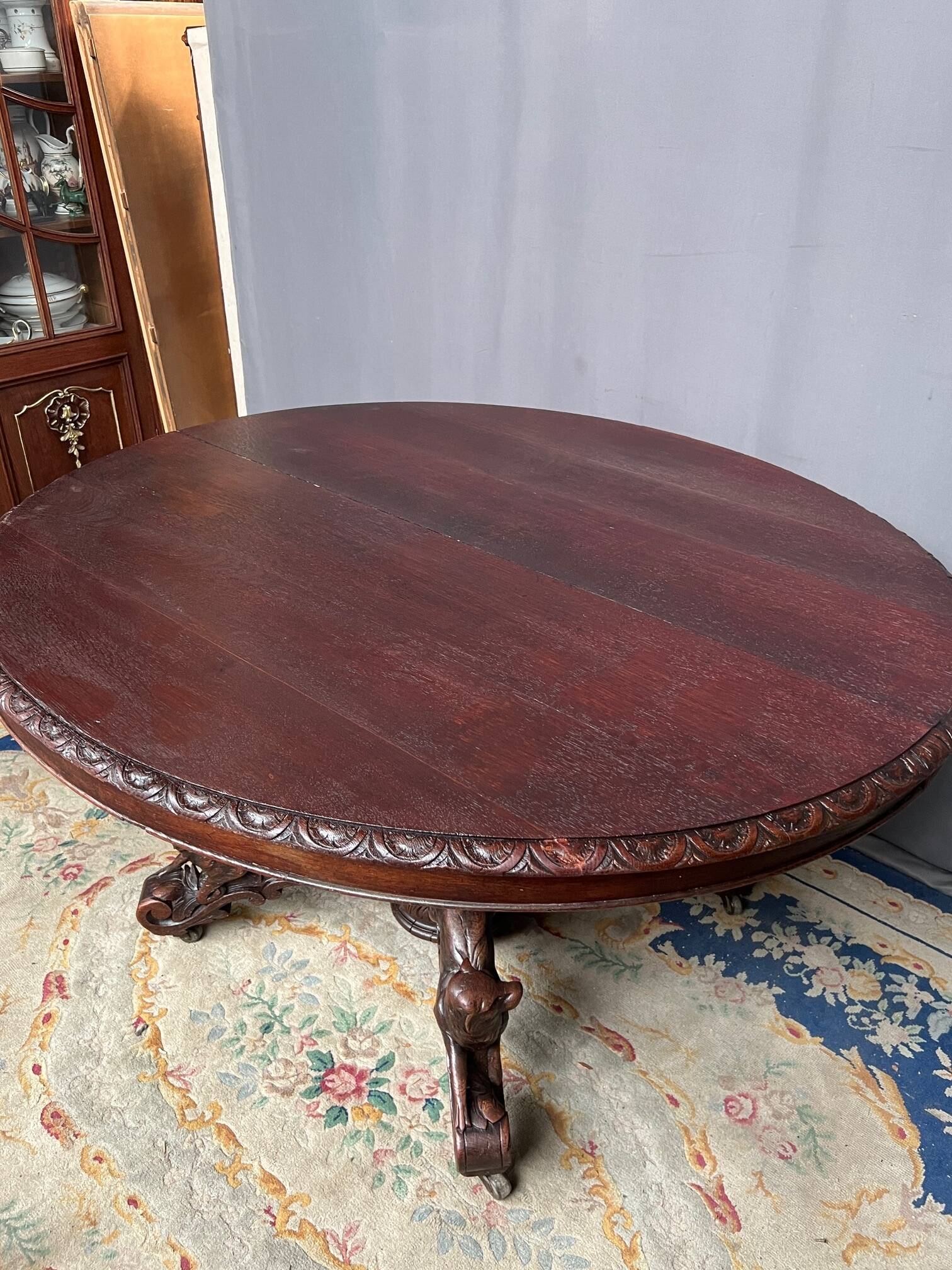 Hunting style dining table with figures of four different animals.