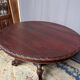 Hunting style dining table with figures of four different animals.