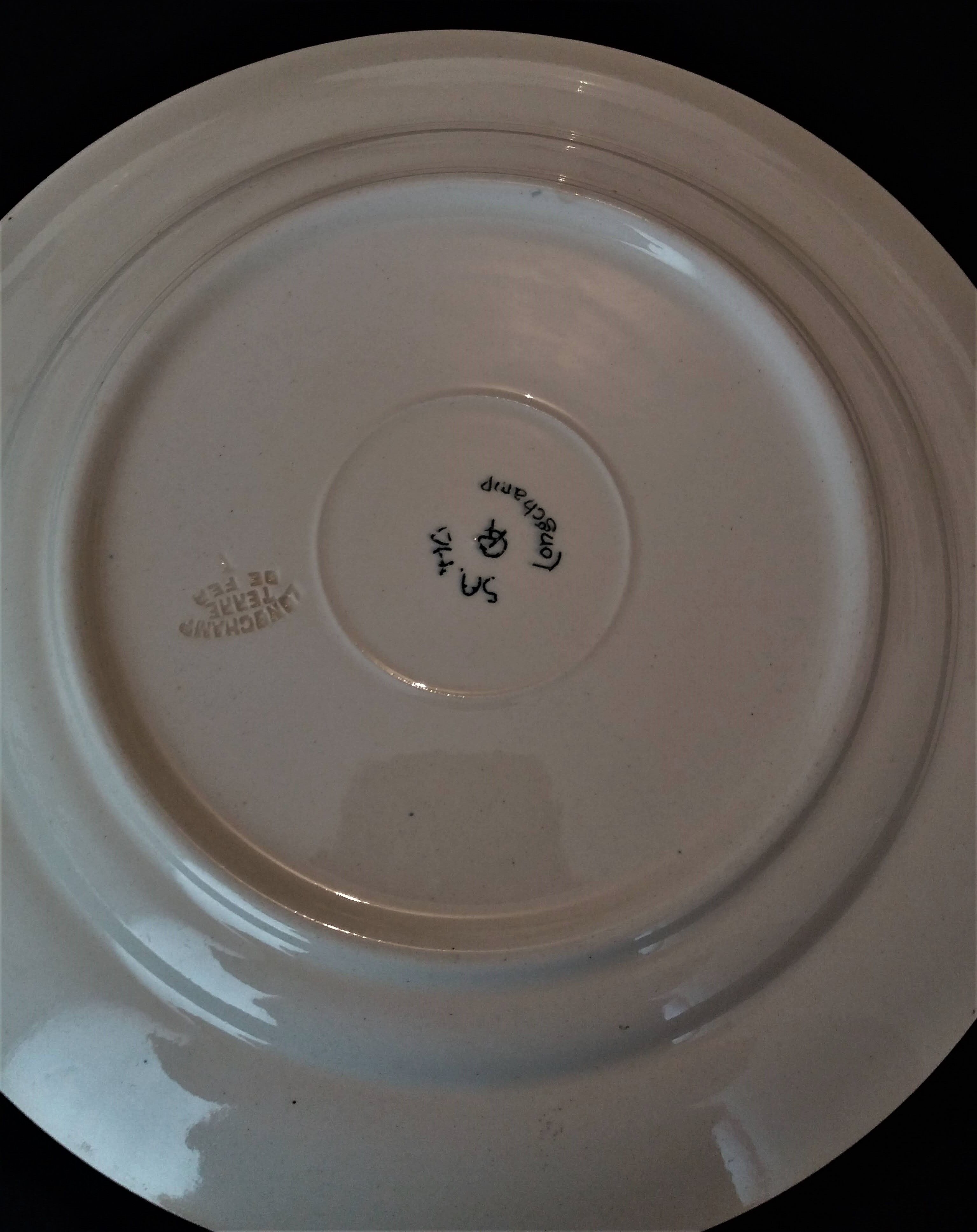 Série de six assiettes plates en faïence de Longchamp modèle Sapho