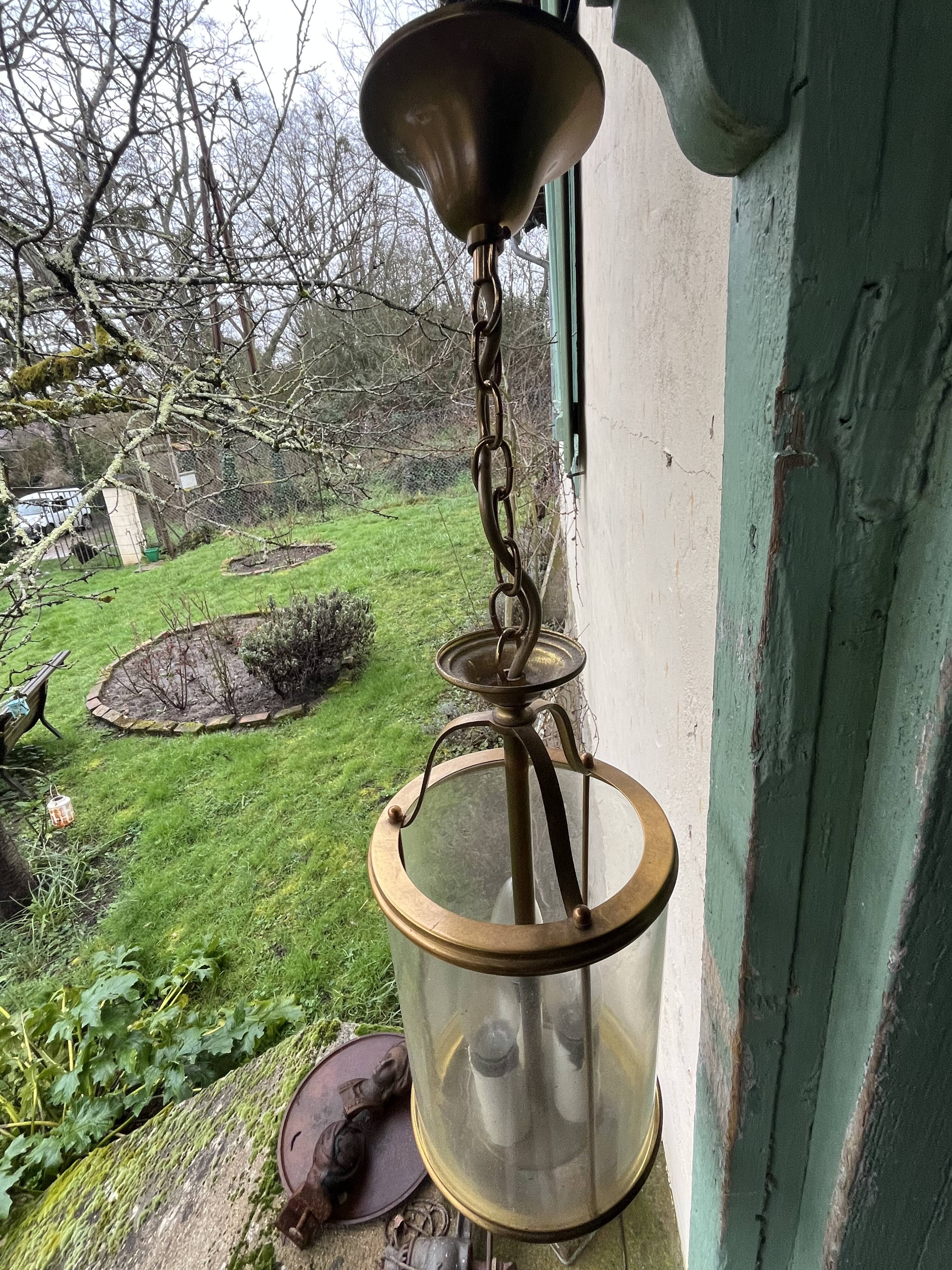 Pair of glass and brass chandeliers