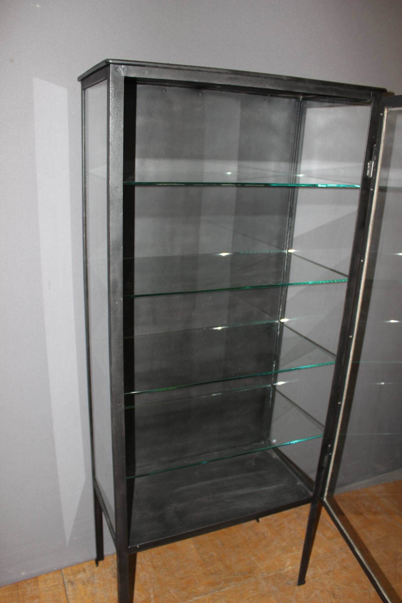 Iron display cabinet with black patina from around 1920