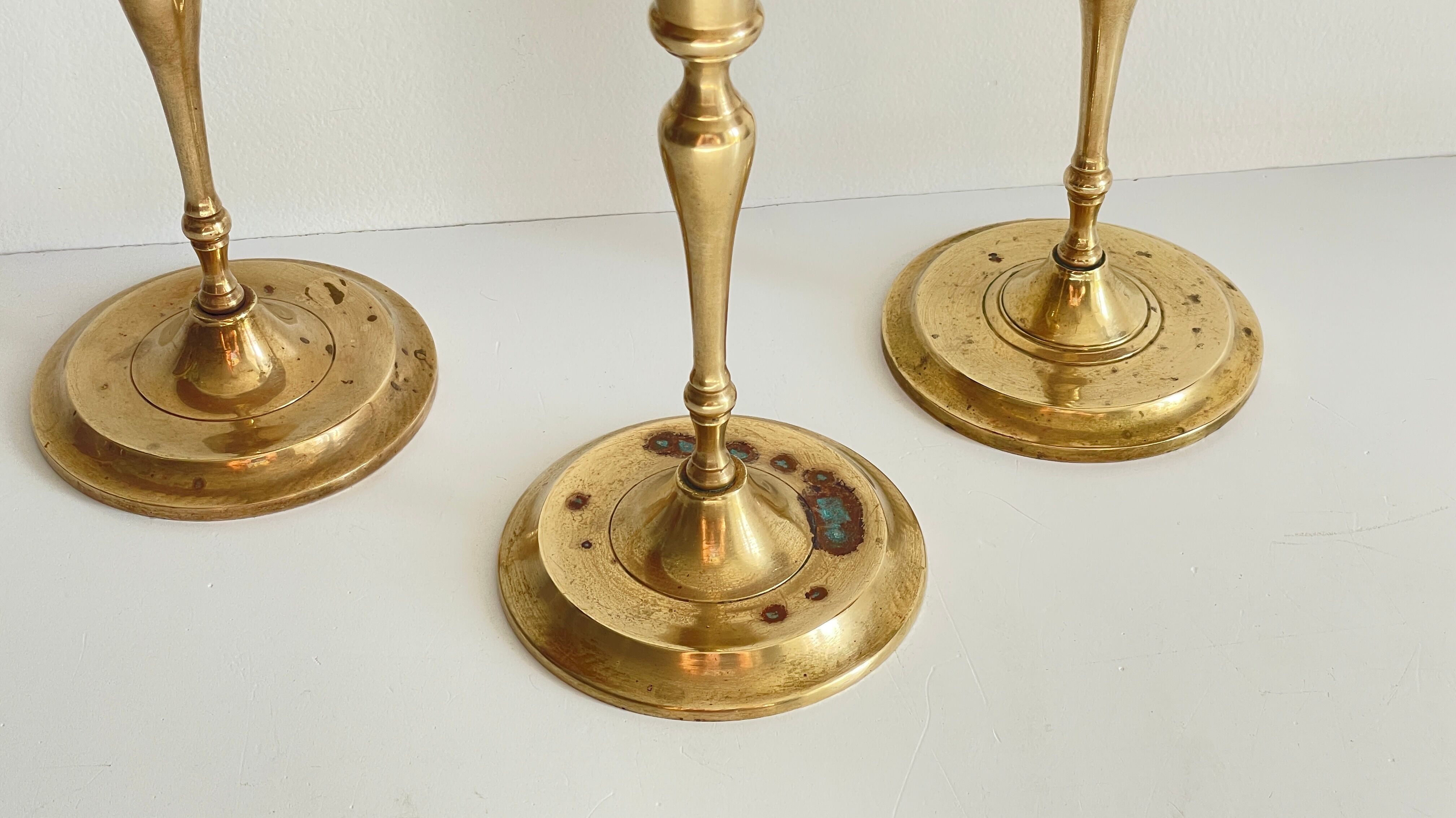 3 patinated brass candle holders
