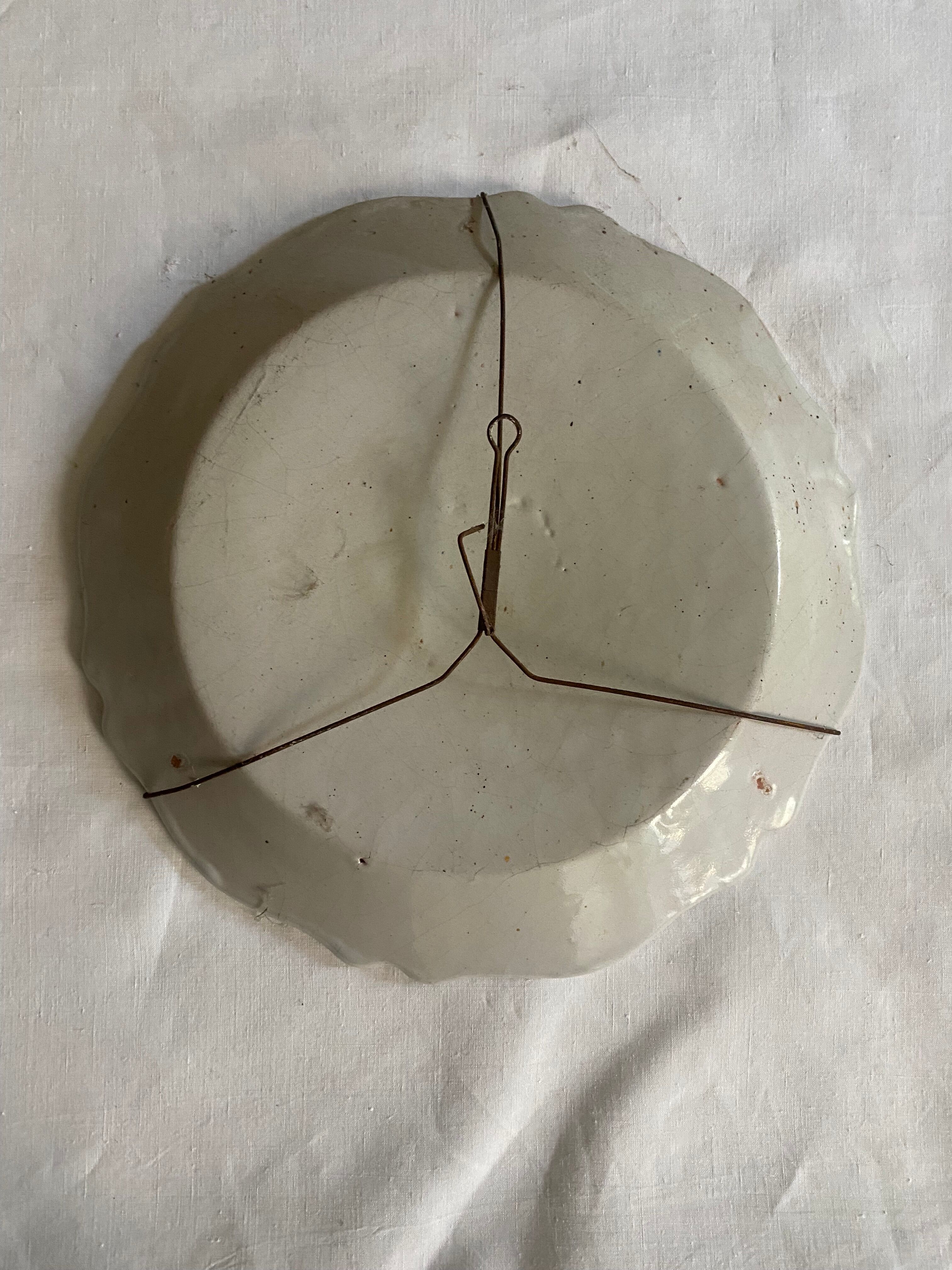 Plate of Nevers in earthenware late eighteenth century decoration of vegetable friezes