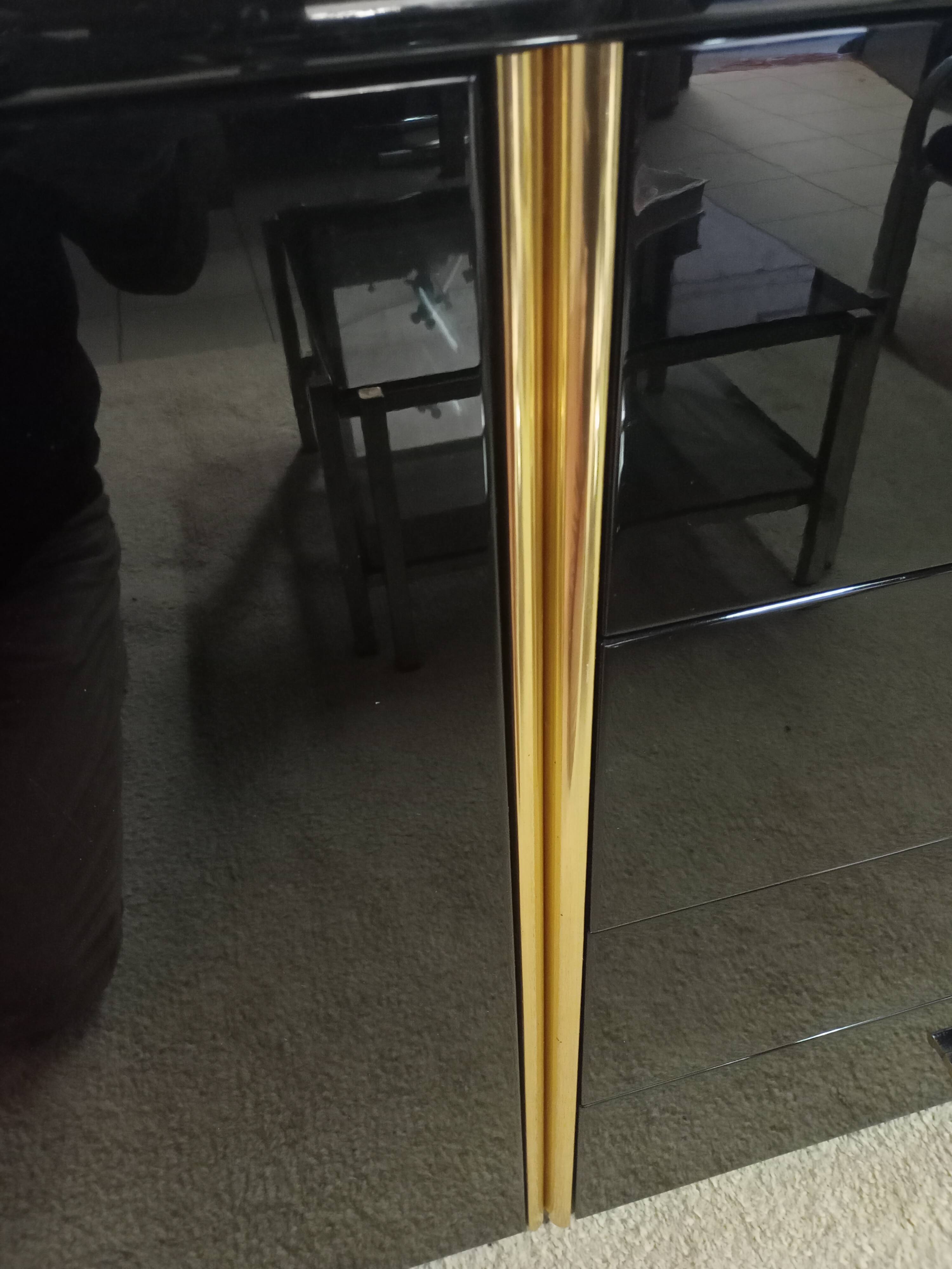 Black lacquered and brass design 70/80