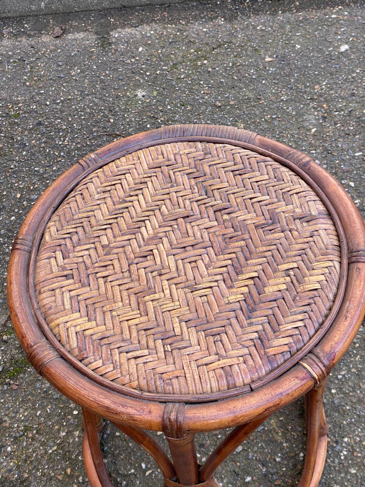 Vintage round stool in bamboo, rattan, and wicker.