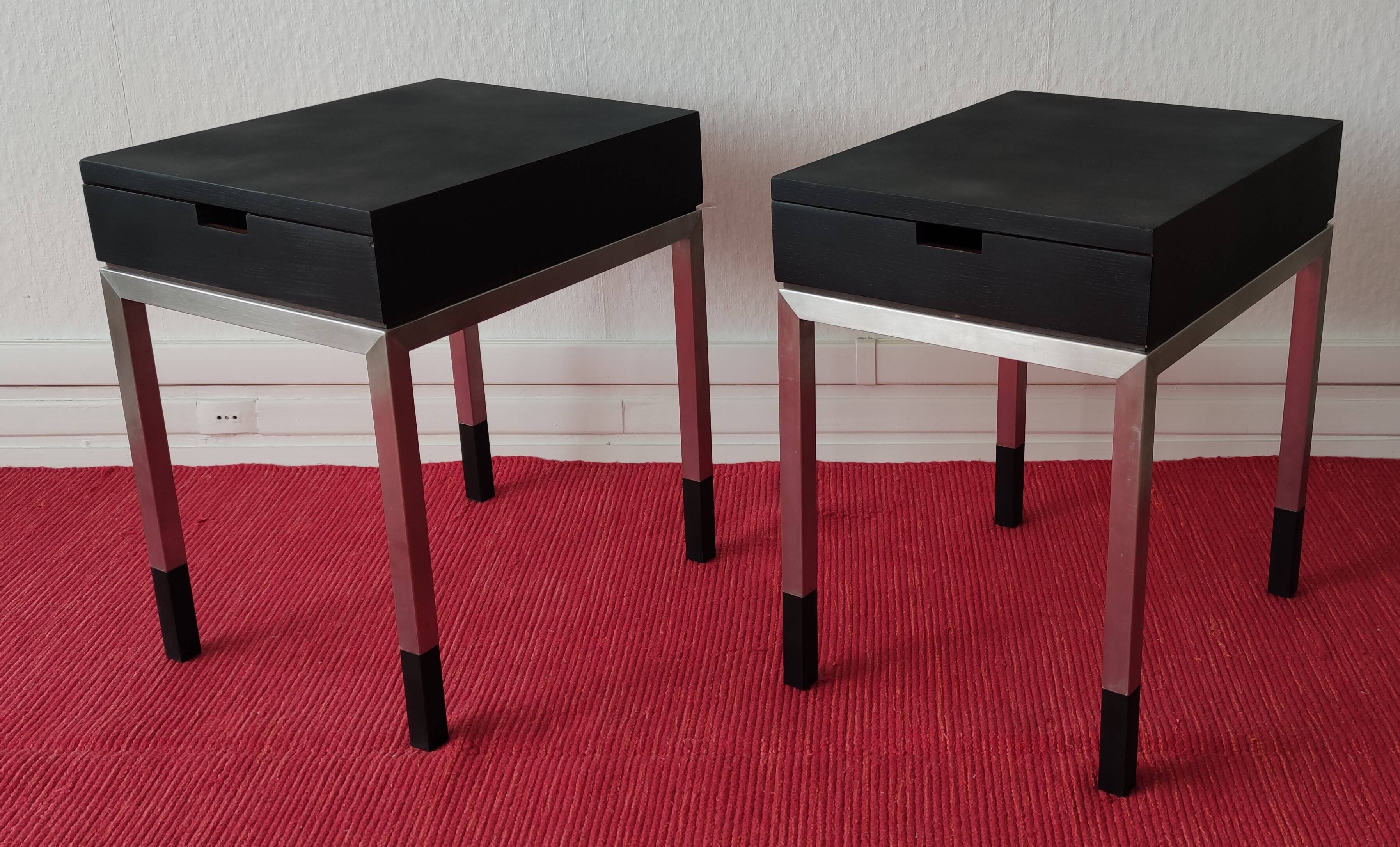 A pair of minimalist bedside tables