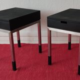 A pair of minimalist bedside tables