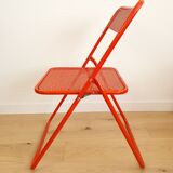 Perforated metal folding chair