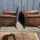 Pair of club armchairs in wood and leather, early 20th century.