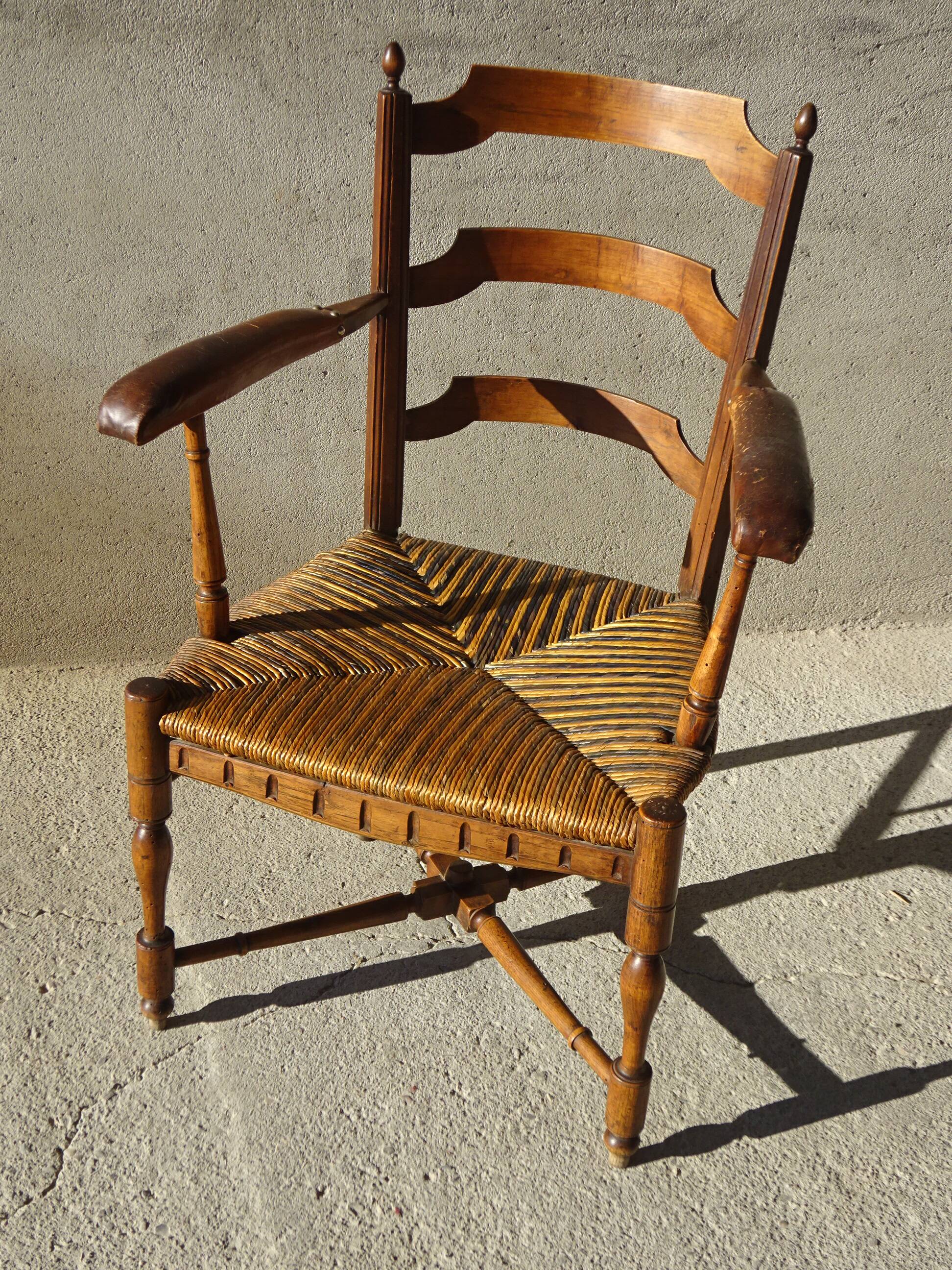 old armchair with leather armrests, from the 19th century