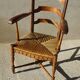 old armchair with leather armrests, from the 19th century