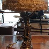 Brass cherub-laying lamp