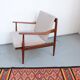 Vintage teak lounge chair, retro 1960s–70s style.