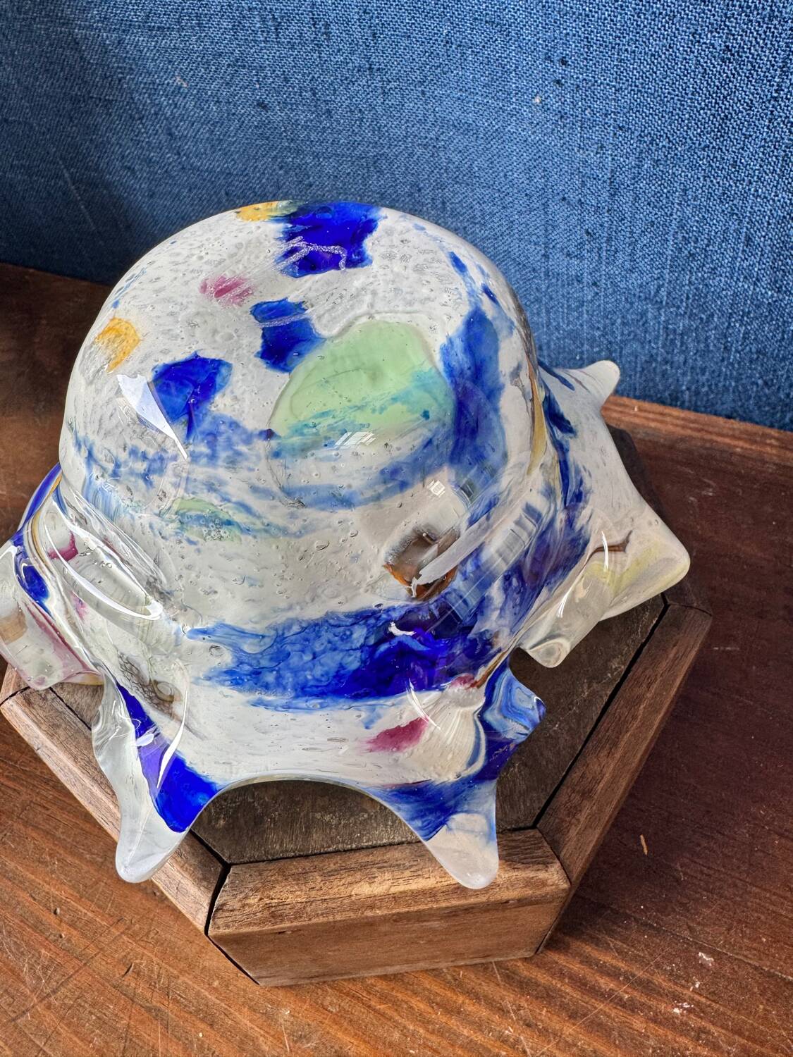 Multi-layer glass ashtray with metallic oxide inclusions.