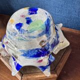 Multi-layer glass ashtray with metallic oxide inclusions.